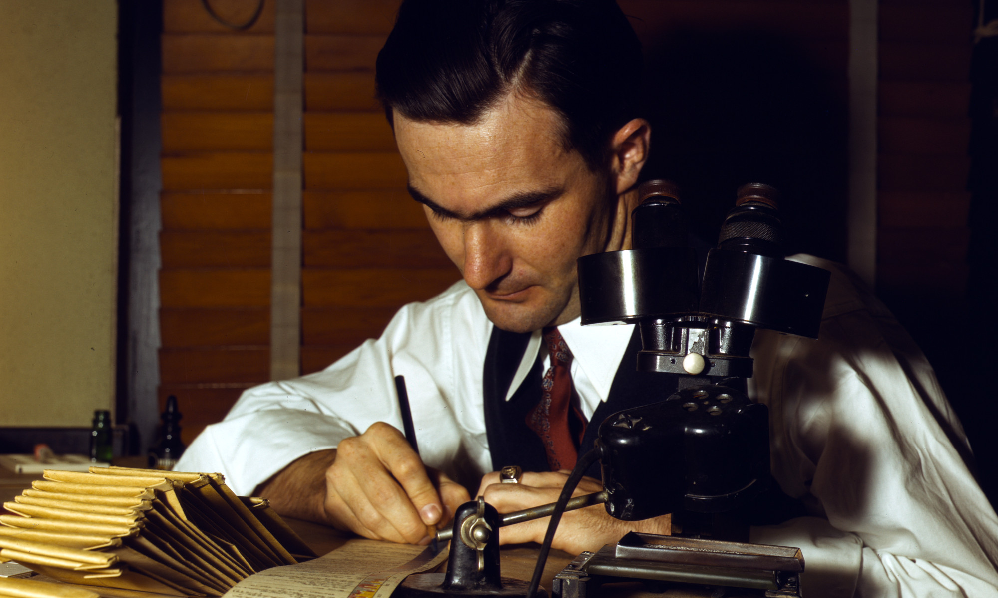 Photograph from the forties of scientist with microscope