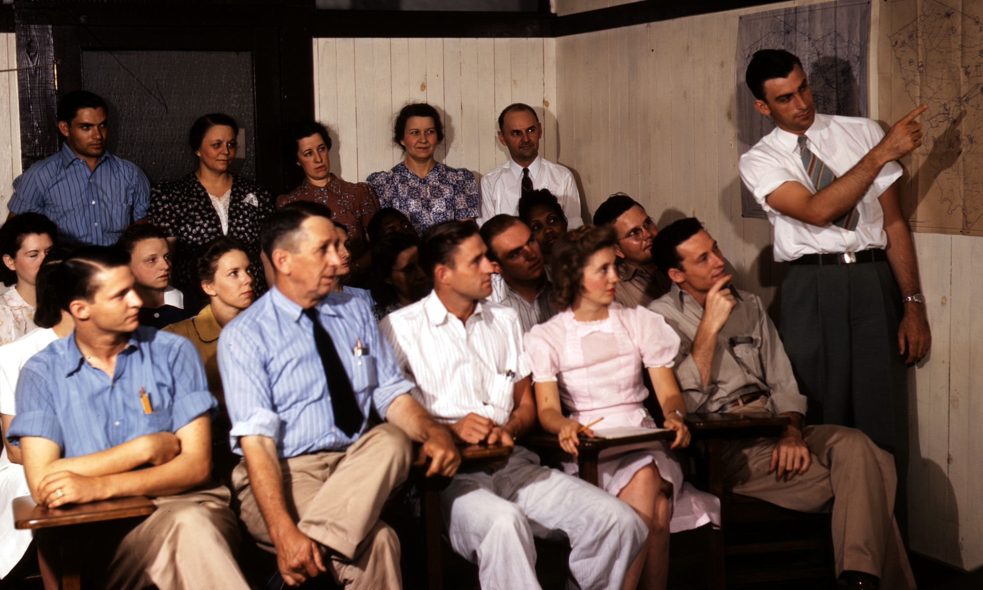 Photograph from the forties of people attending a presentation